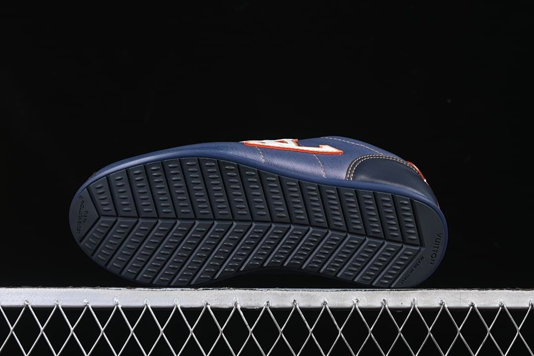 Underside view showing the patterned dark blue outsoles