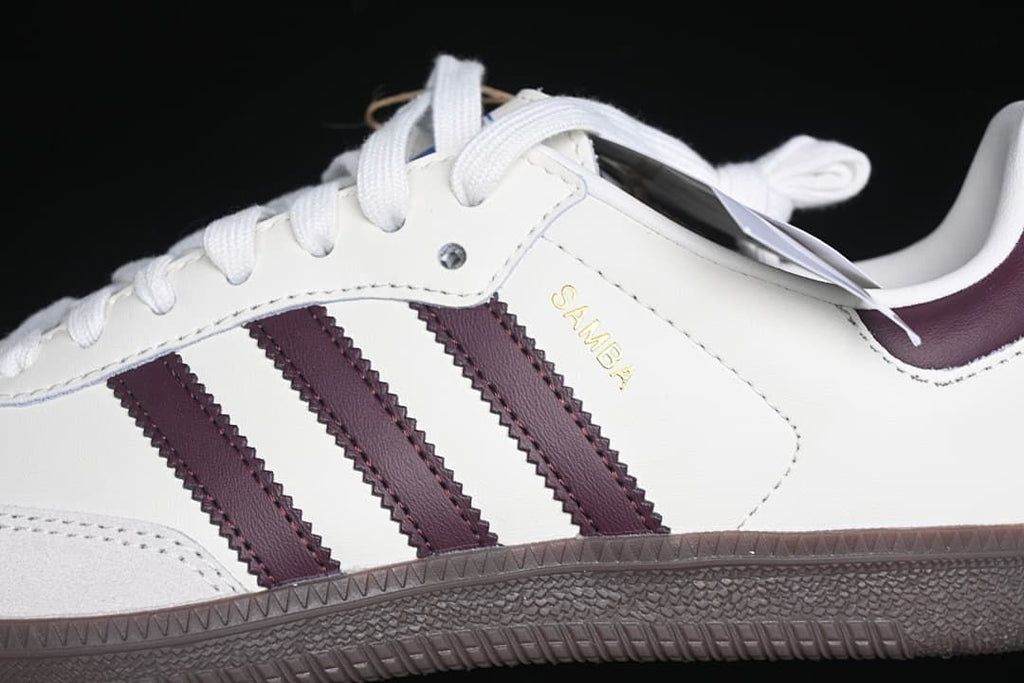 Close-up of burgundy stripes, Samba lettering, and side stitching
