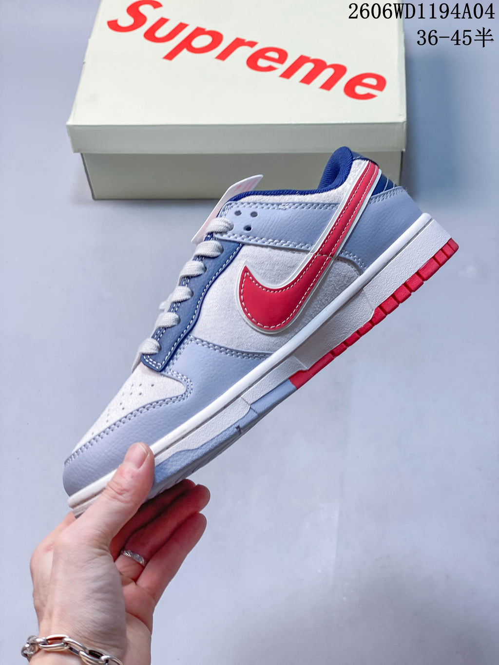 Side view highlighting the red Swoosh and color-block overlays