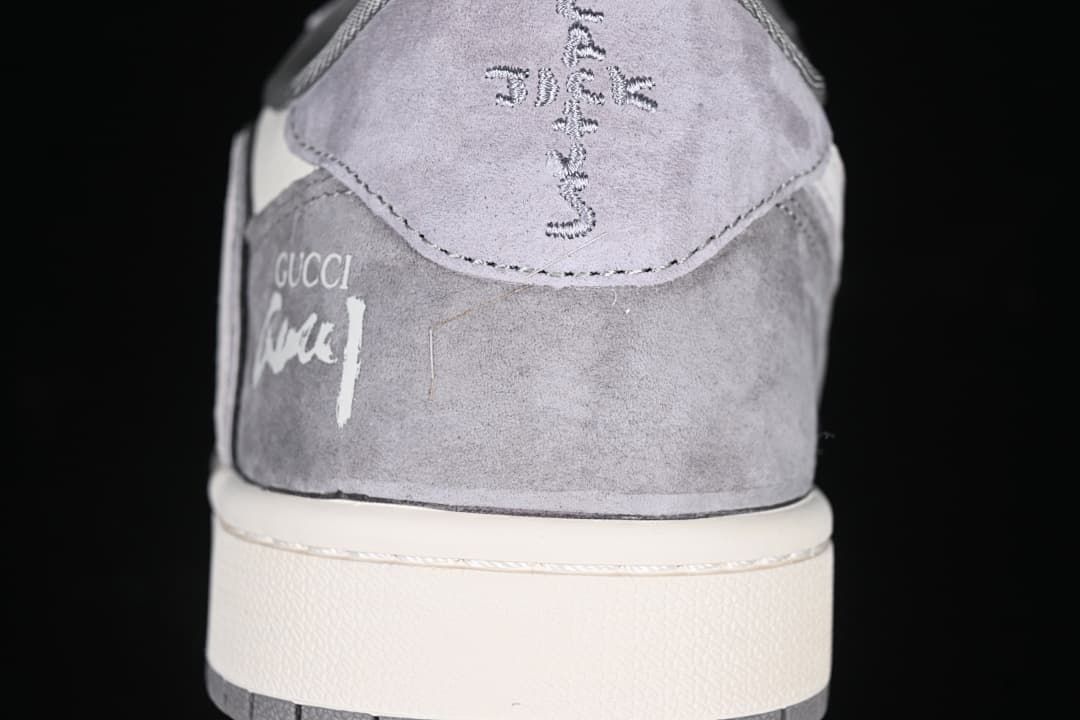 Rear view of the sneaker showing heel graphics and a white midsole