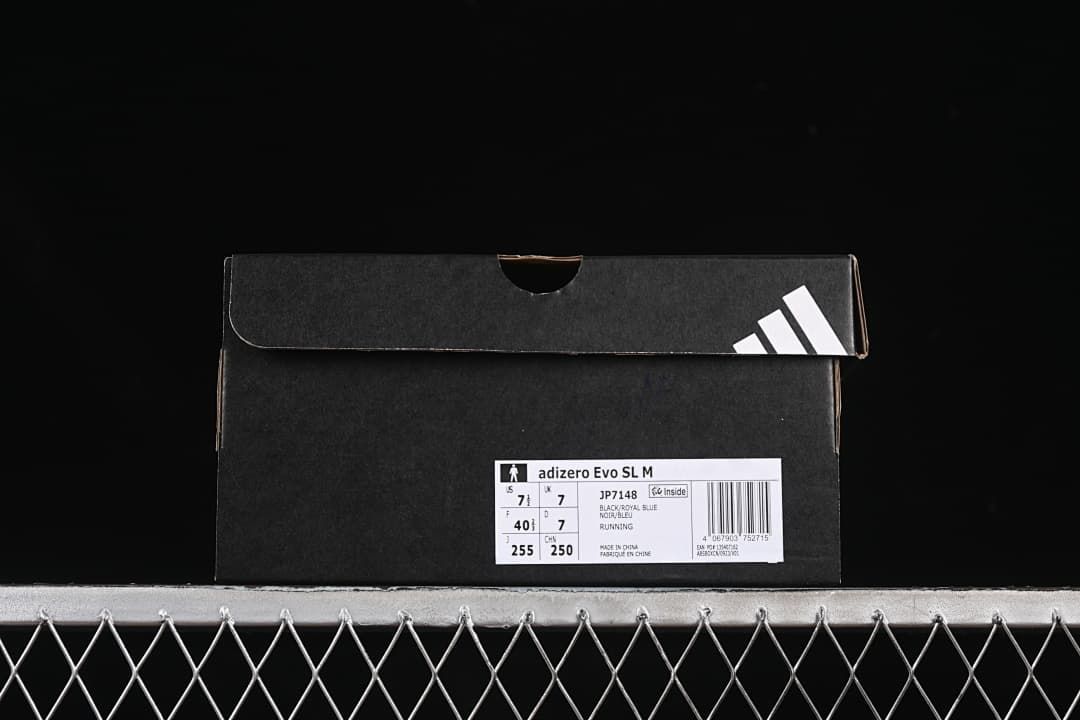 Shoe box label showing Adizero Evo SL M, JP7148, and sample size details.