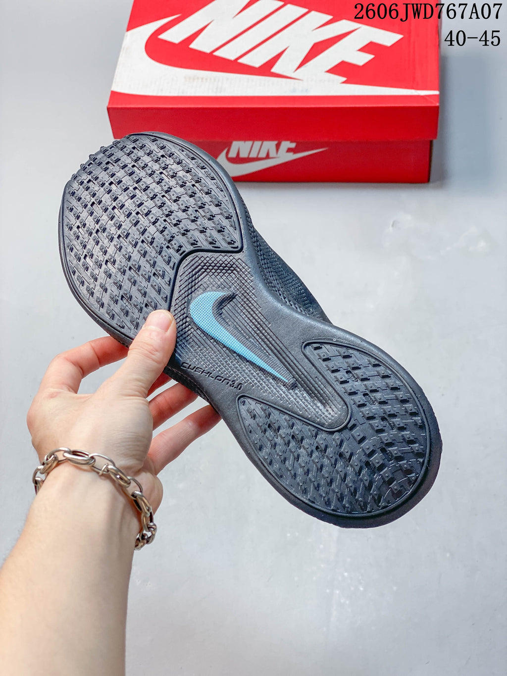 Close-up of the patterned outsole with a teal accent