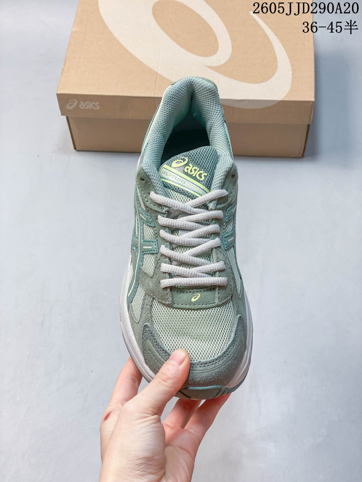 Front view of a sage-green ASICS GEL-1130 sneaker