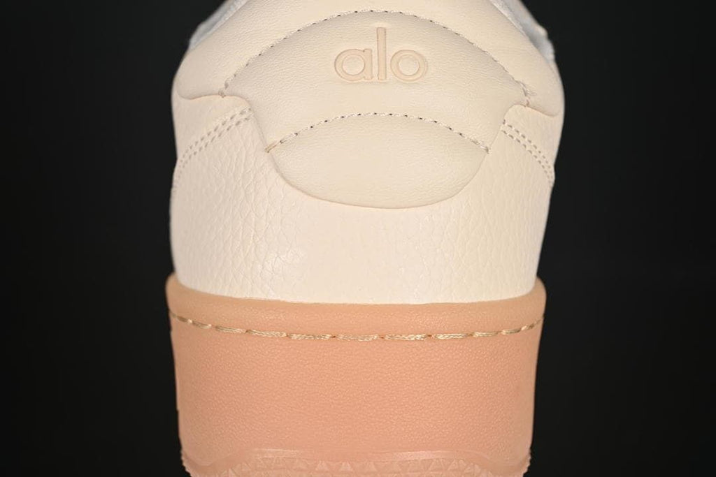 Rear view of the sneaker showing heel branding and gum-tone sole