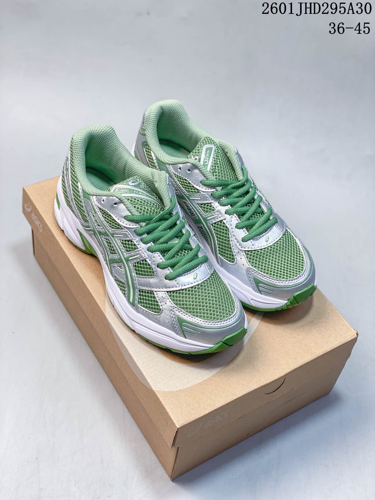 Pair of green and silver ASICS GEL-NIMBUS 10.1 sneakers on a shoebox; image text shows size range 36–45.