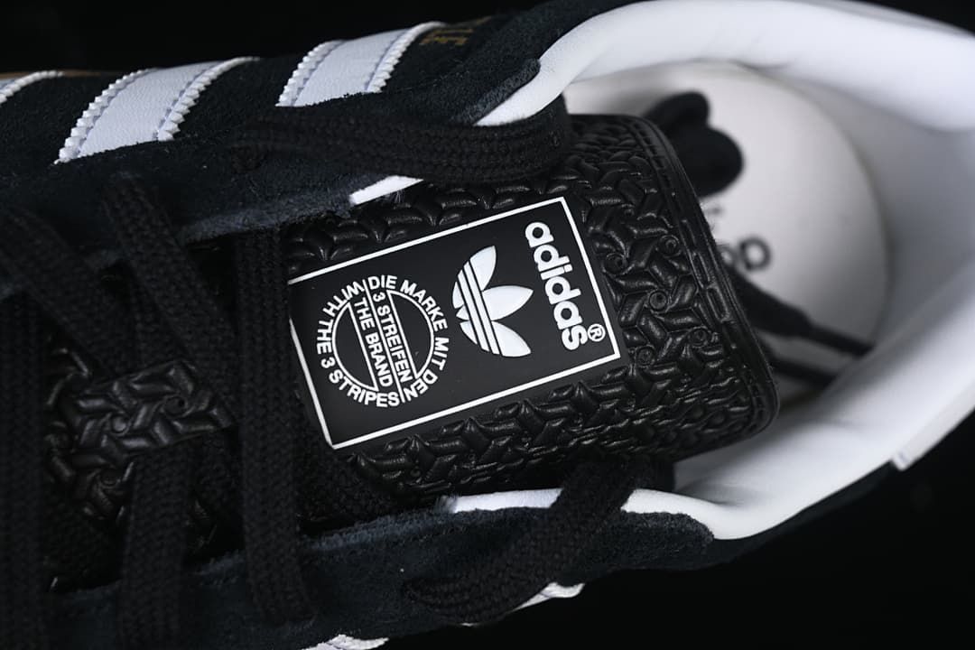 Close-up of the adidas Originals tongue label and black laces.