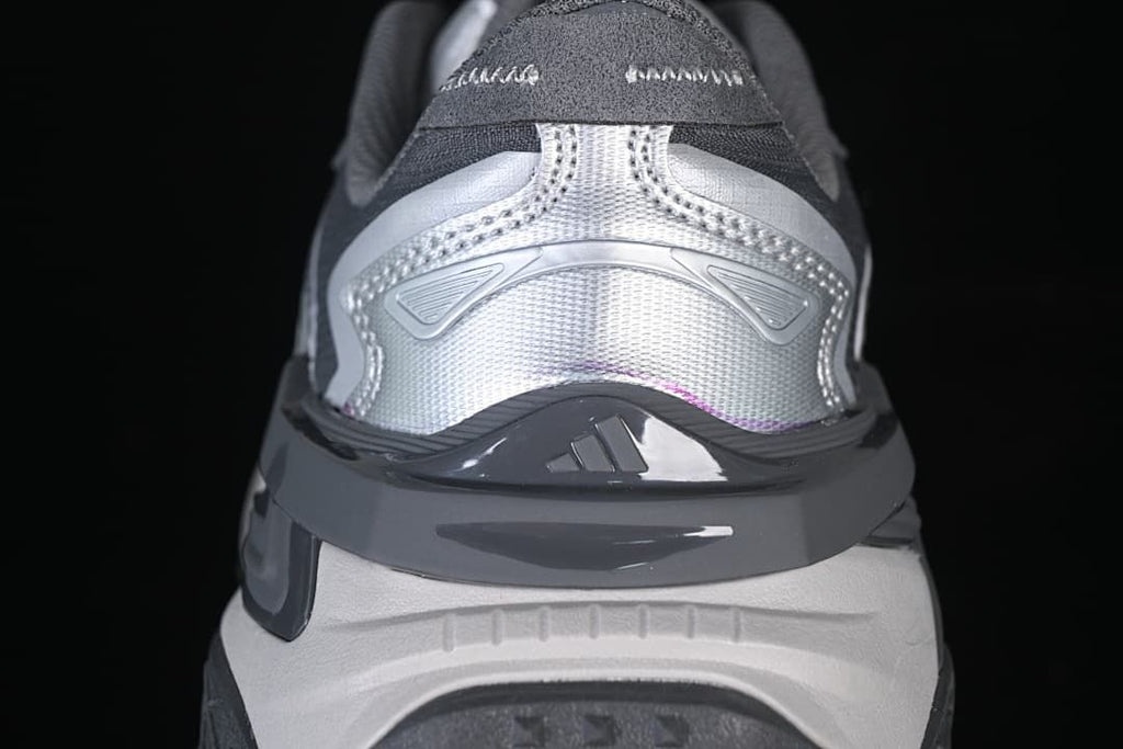 Rear view of the sneaker showing silver heel panels and dark gray trim.