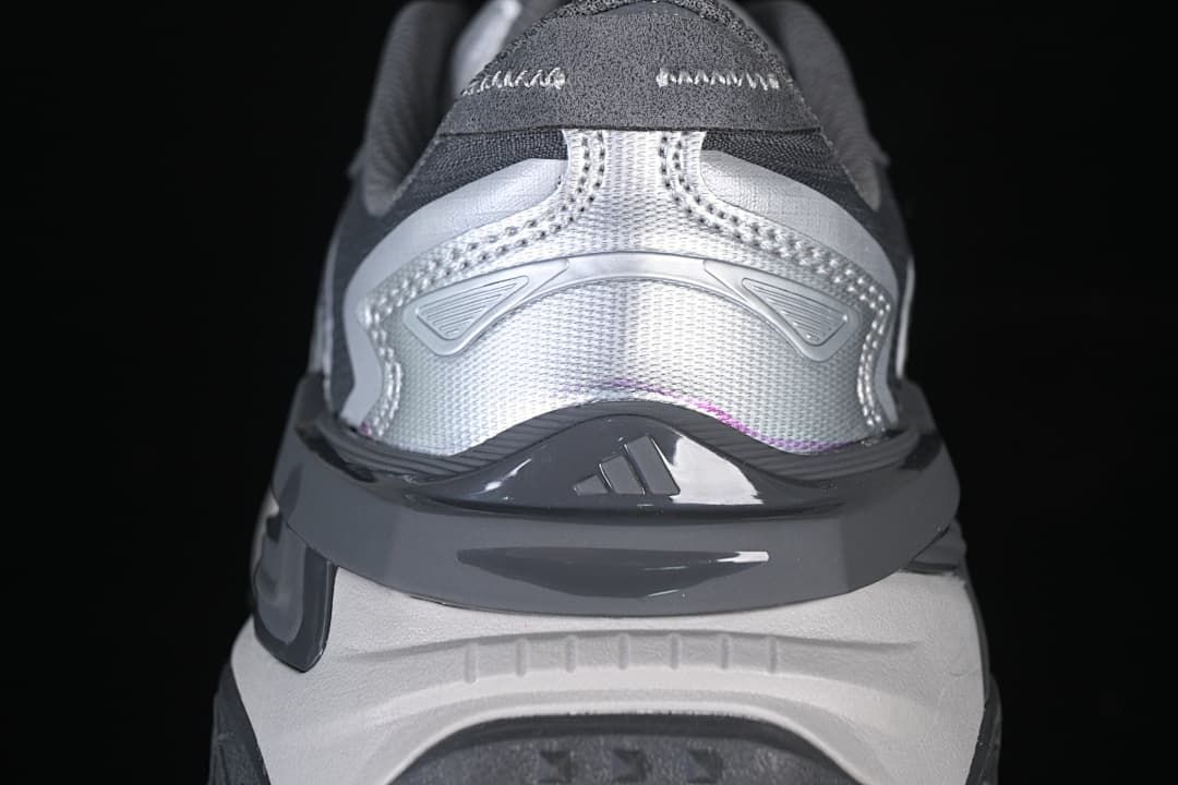 Rear view of the sneaker showing silver heel panels and dark gray trim.
