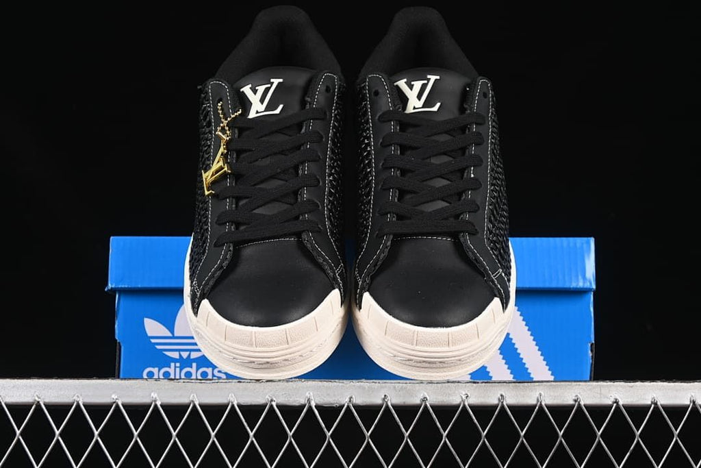 Front view of the pair showing the shell toes, laces and tongue logos