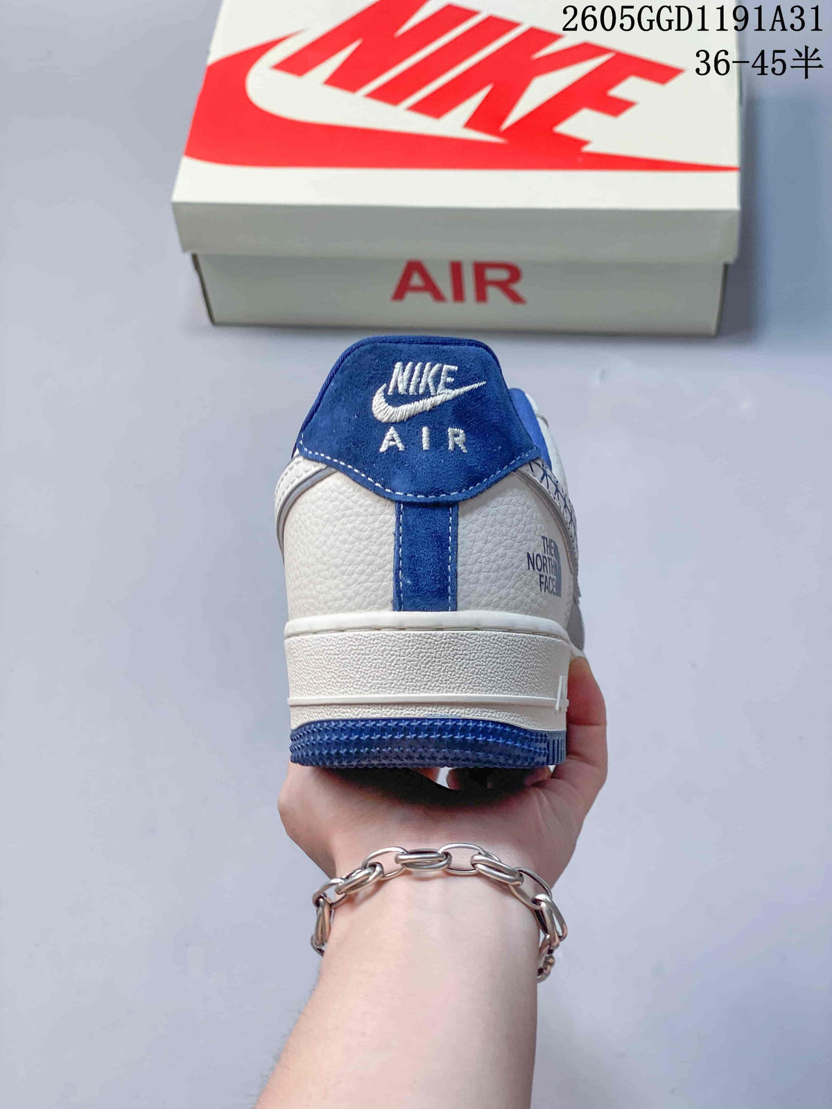 Rear view of the sneaker showing blue heel details and The North Face branding.