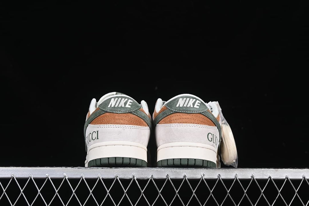 Rear view of both sneakers showing heel branding and green outsoles