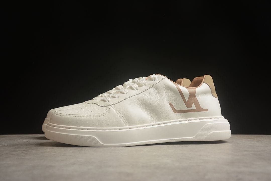 Three-quarter side view of the sneaker with a large side logo