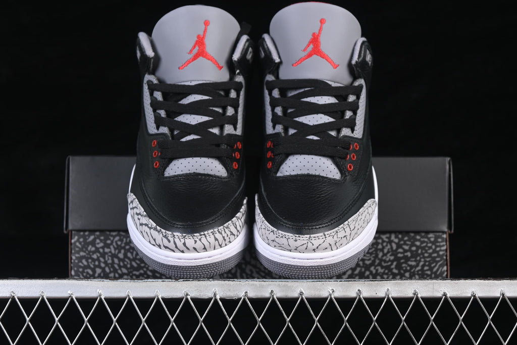Front view of the pair showing grey perforated panels and red tongue logos