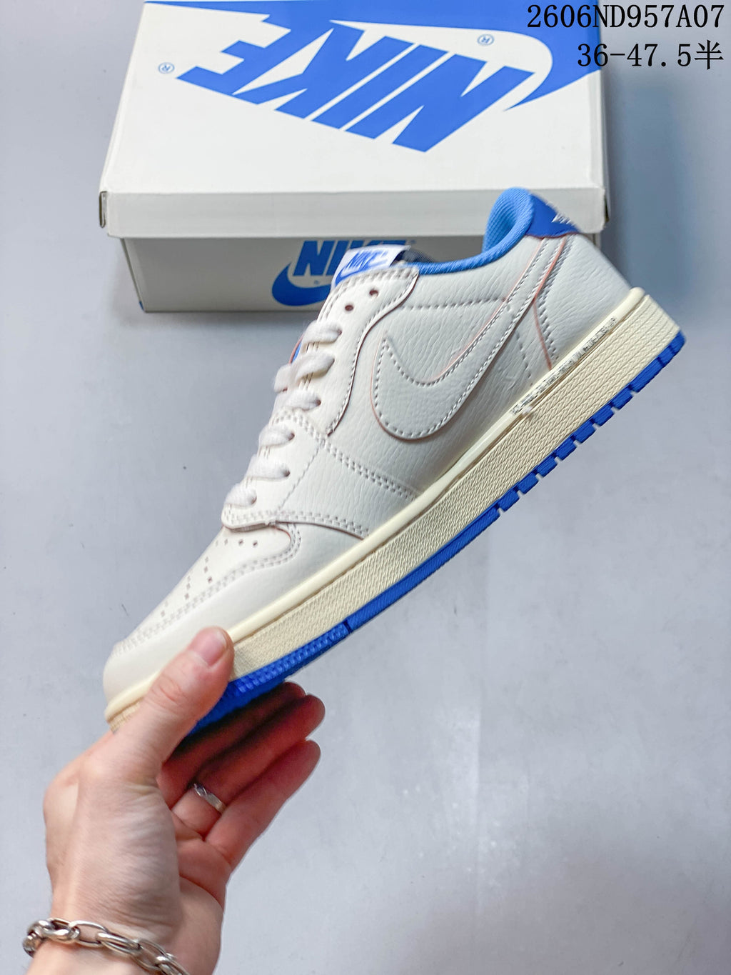 Side profile of an off-white low-top sneaker with blue accents