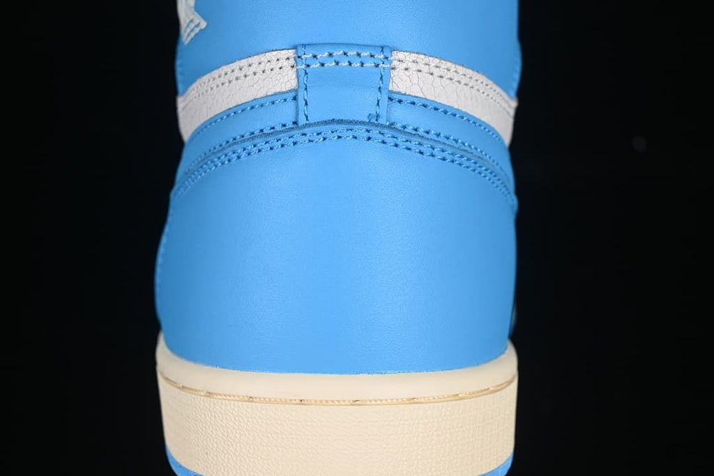 Rear view of the blue heel and light-colored midsole