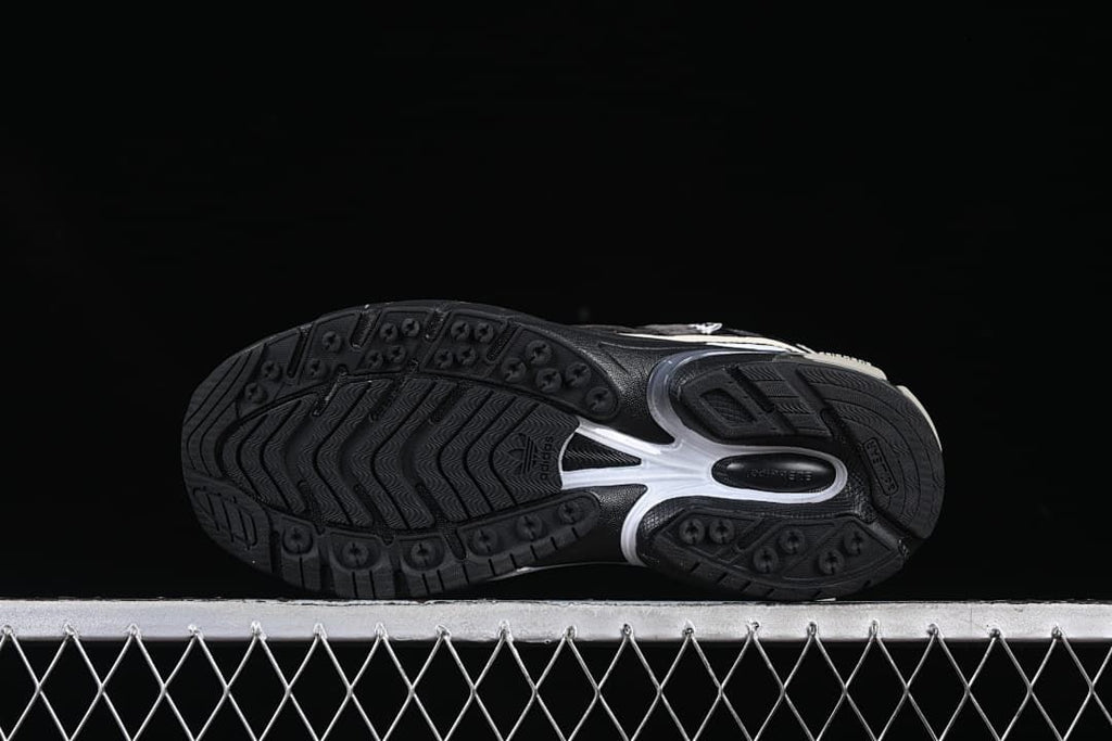 Underside view showing the patterned black outsole.