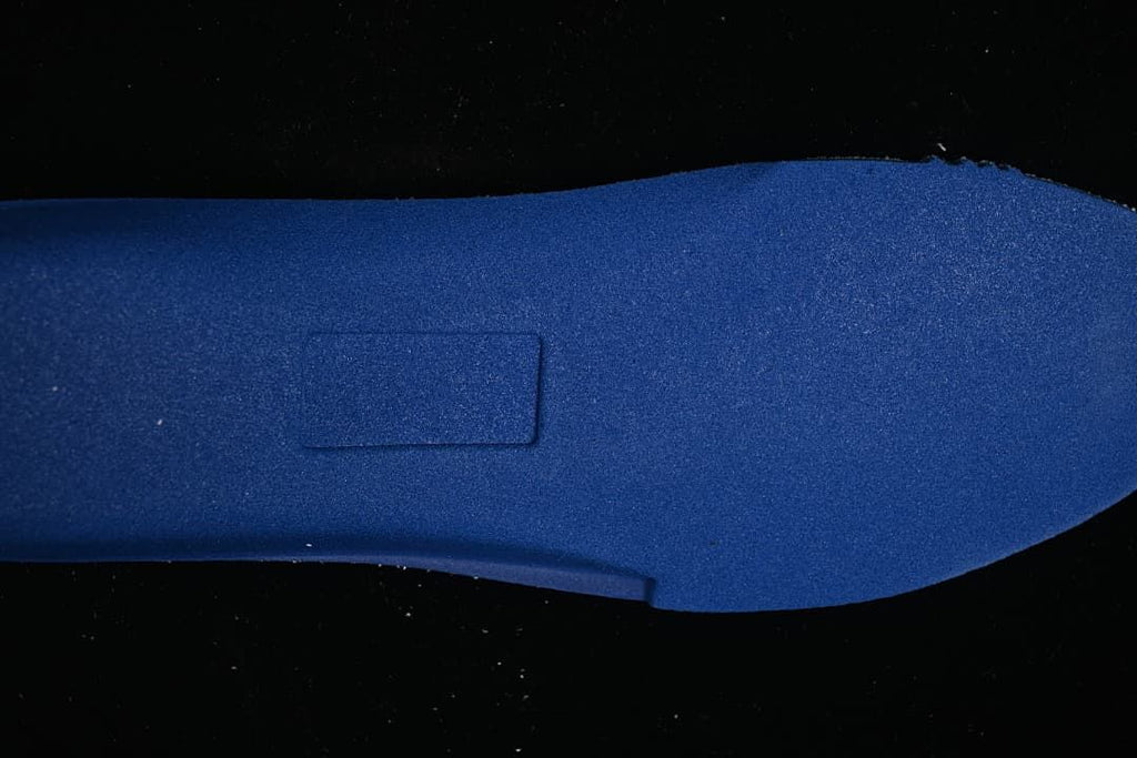 Close-up of the blue-toned shoe outsole surface.