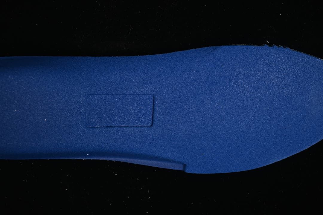 Close-up of the blue-toned shoe outsole surface.