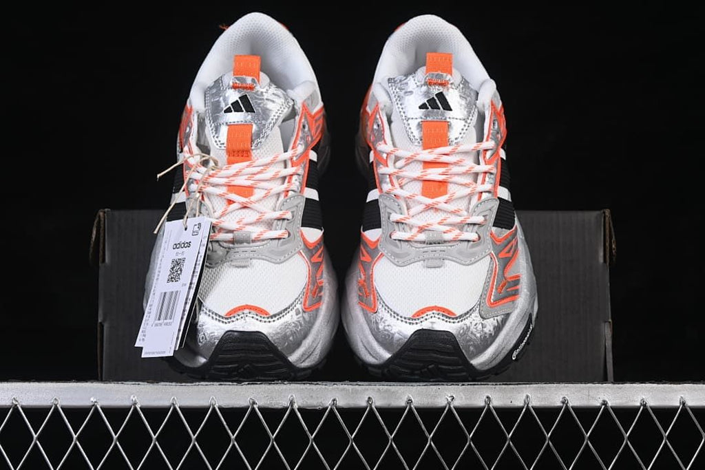 Front view of the pair showing the mesh toes and orange accents
