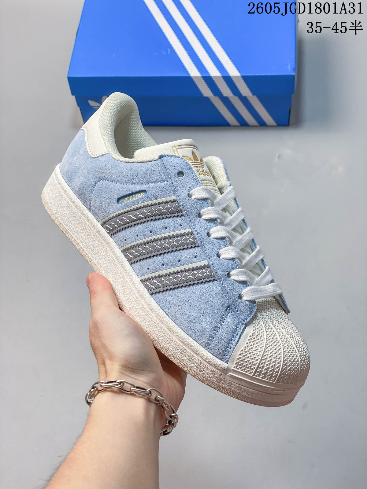 Angled side view of a light blue Campus 00s sneaker with silver stripes and a cream shell toe.