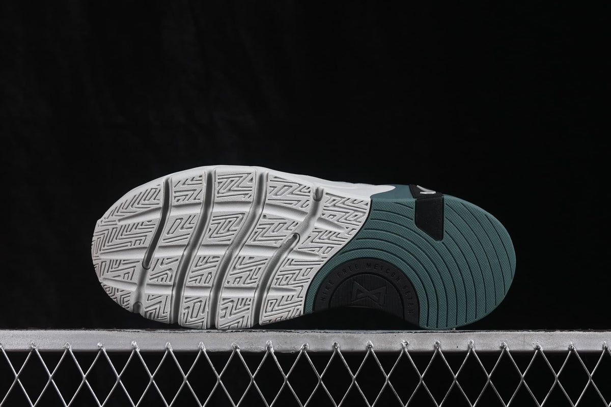 Outsole view showing the segmented construction and patterned tread.
