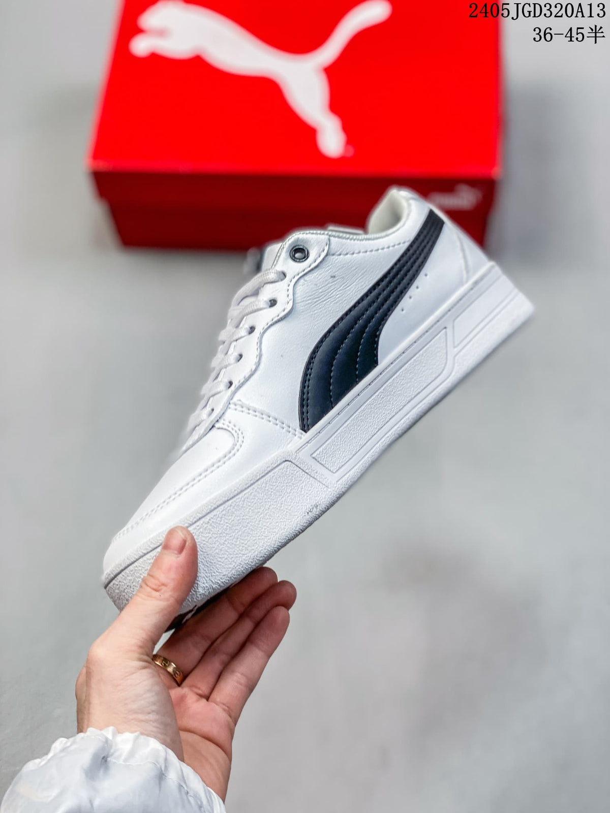 Side view of a white sneaker with a black PUMA stripe