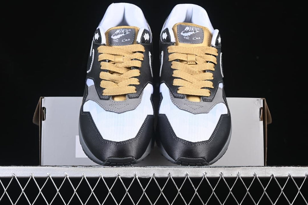 Front view of the pair showing the contrasting toe panels and gold-tone laces
