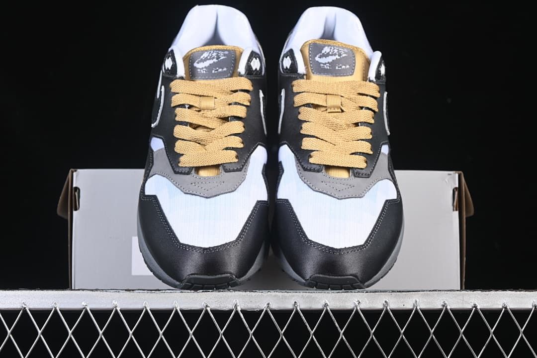 Front view of the pair showing the contrasting toe panels and gold-tone laces
