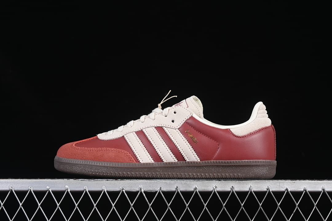 Side view of burgundy and cream adidas Samba OG sneakers with a dark brown outsole