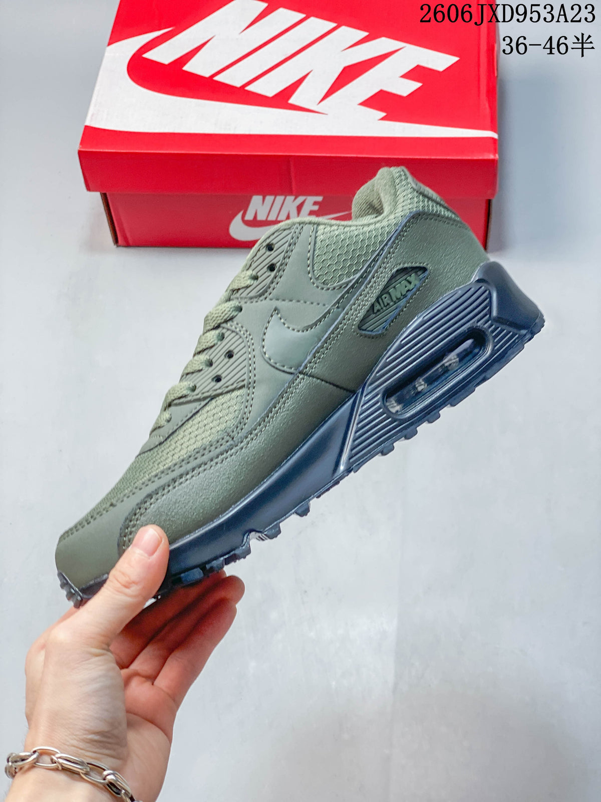 Side view of the olive green Nike Air Max 90 showing the heel Air unit