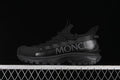 Side view of a black Moncler Trailgrip Lite 2 outdoor sneaker