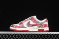 Side view of a red, gray, and off-white Nike SB Dunk Low with a monogram-style pattern and red outsole.