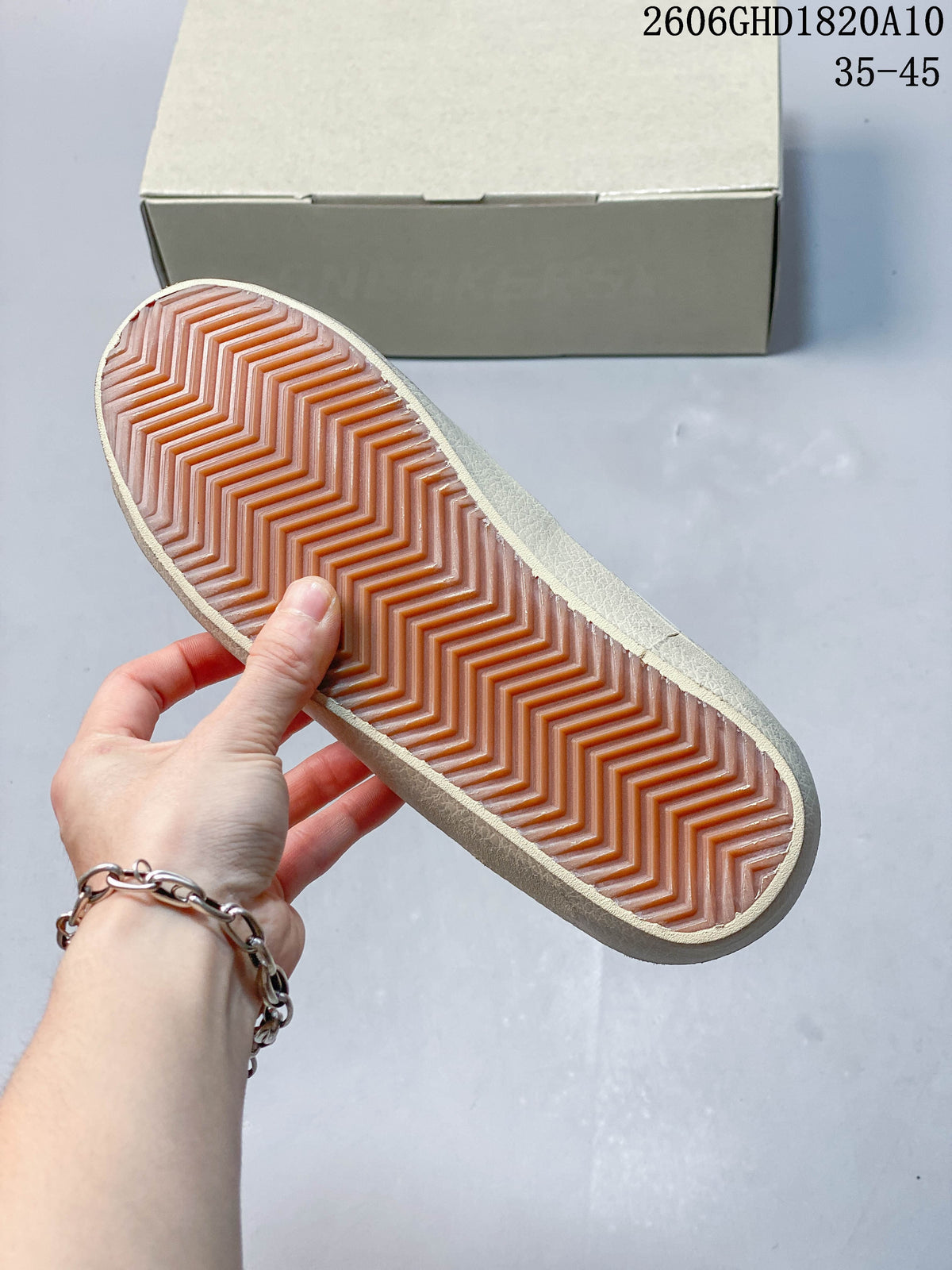 Close-up of the sneaker’s textured sole and herringbone-patterned tread.