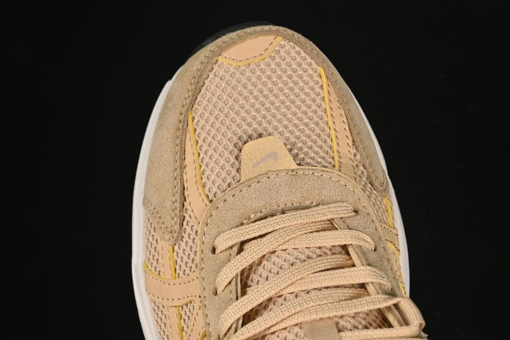 Top view of the mesh toe, suede-like overlays, and laces