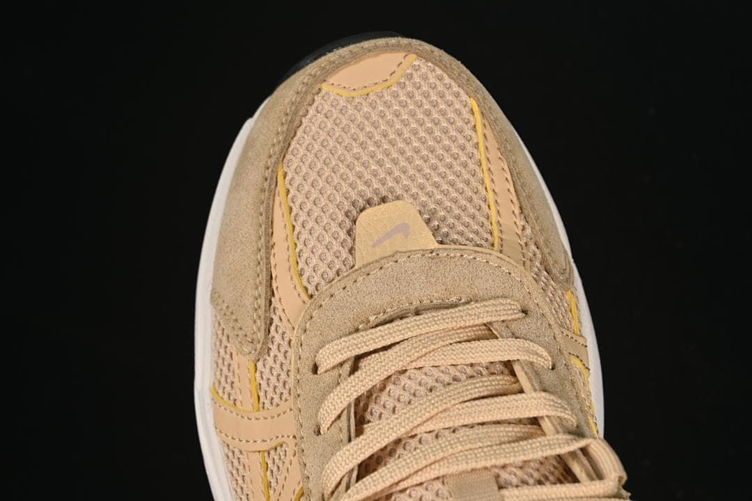 Top view of the mesh toe, suede-like overlays, and laces