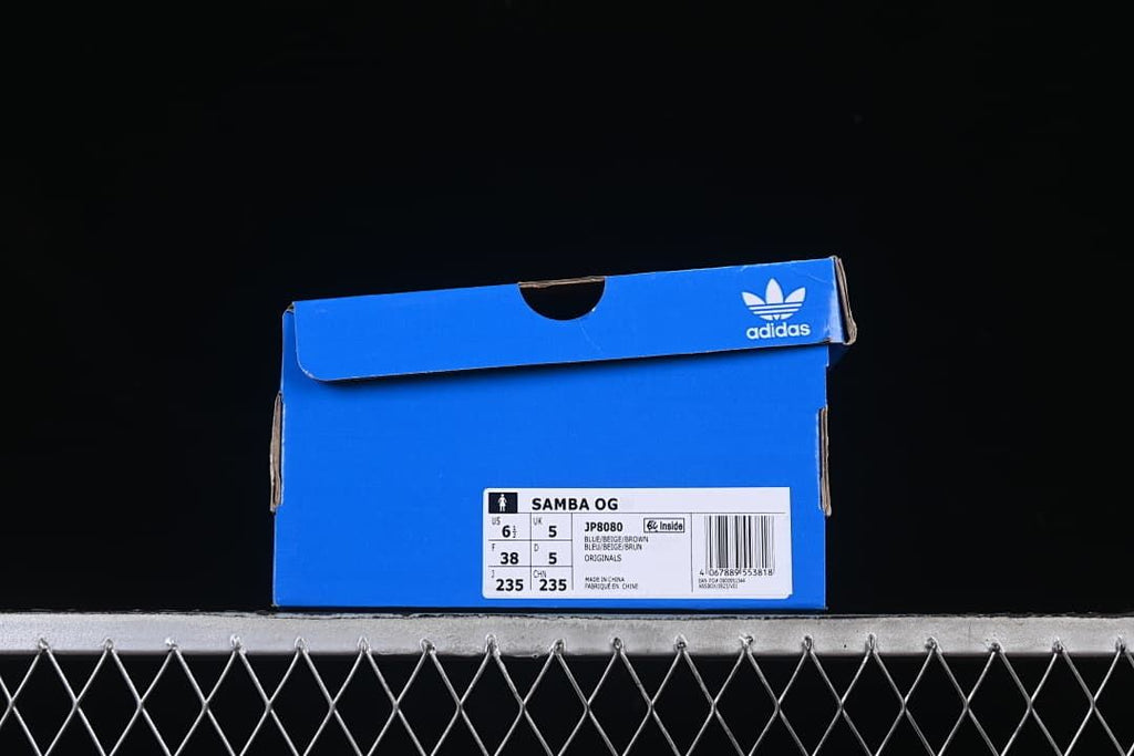 Blue adidas shoe box label identifying the Samba OG, model JP8080, and sample size EU 38