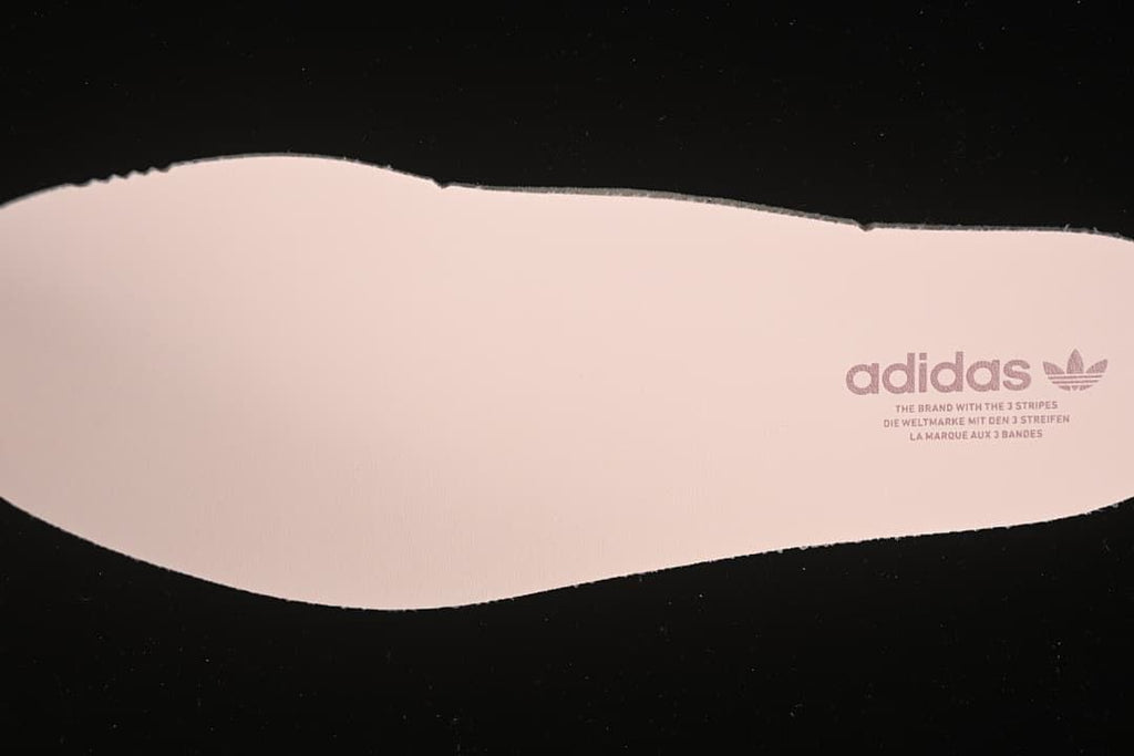 Pink insole with adidas Trefoil branding