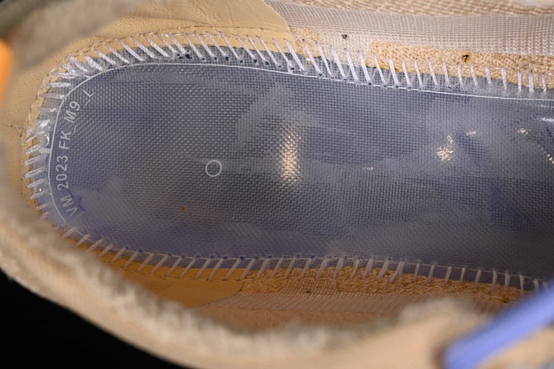 Close-up inside the sneaker showing printed interior lettering.