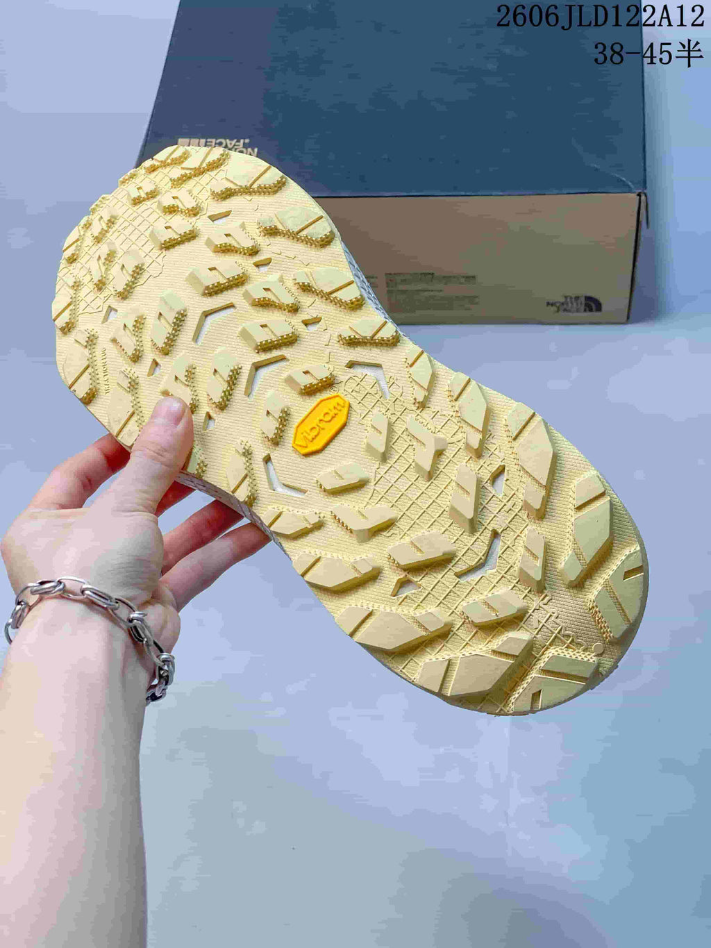 Close-up of the hiking shoe outsole showing a deeply patterned tread and a Vibram mark.