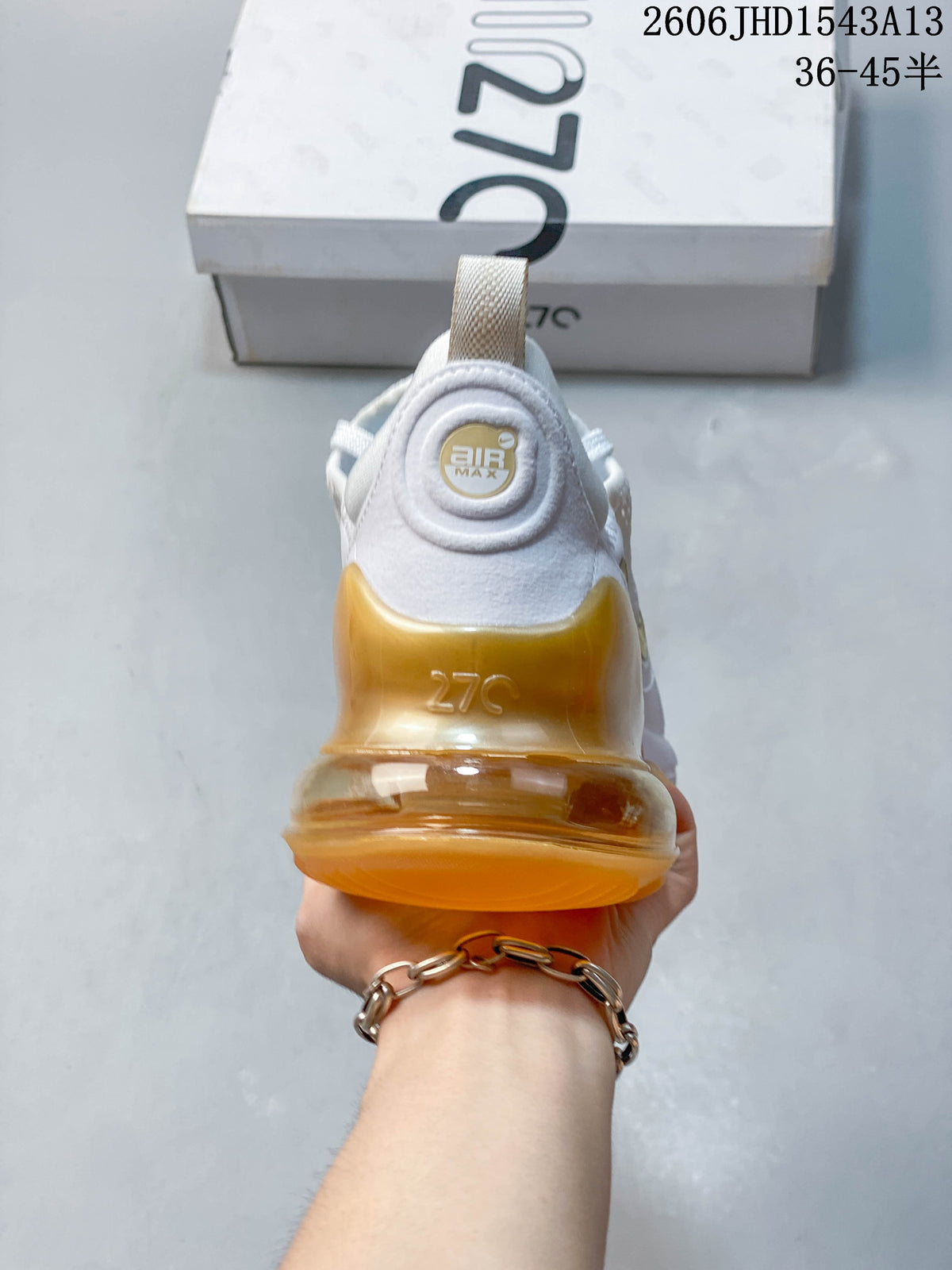 Rear view of a Nike Air Max 270 sneaker with a translucent amber heel unit
