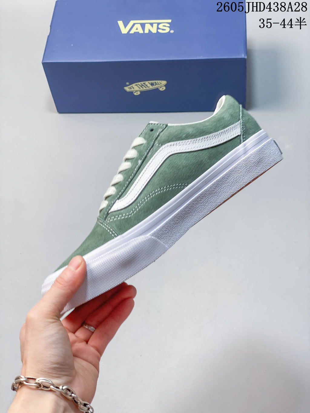 Side profile of the green Vans Old Skool sneaker
