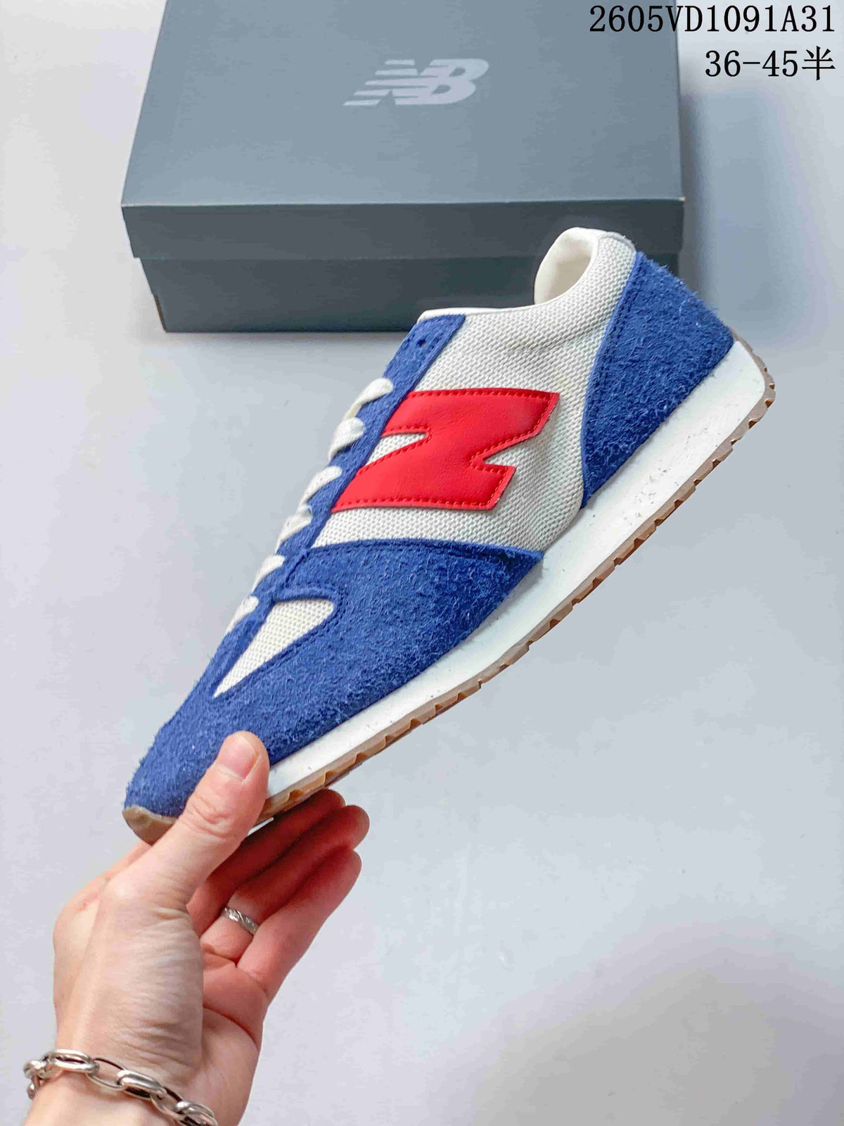 Side view of a New Balance 471 sneaker in blue, white, and red