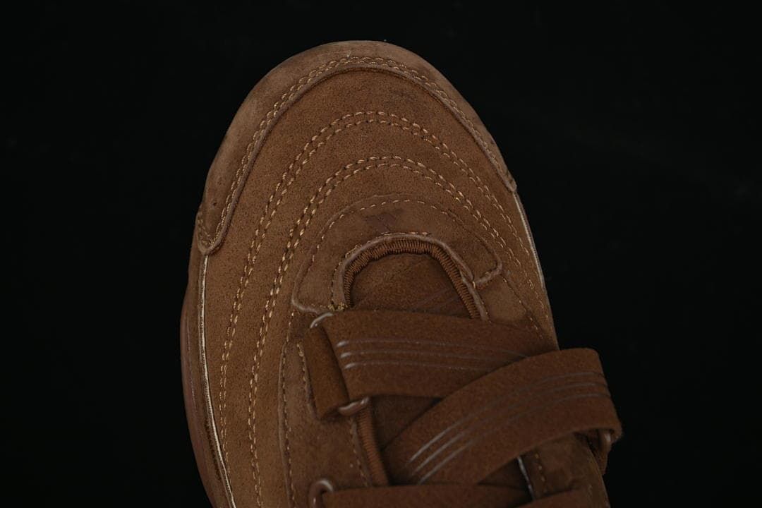 Top view of the sneaker's stitched toe and overlapping straps
