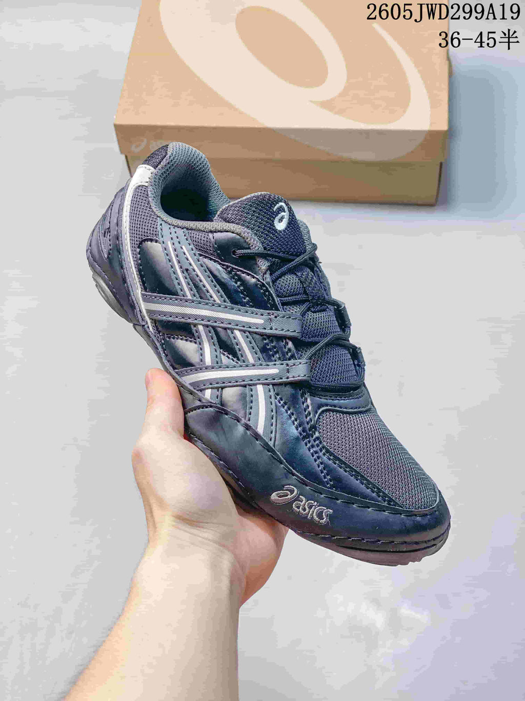 Side view of a light cream ASICS GEL-1130 sneaker with layered overlays