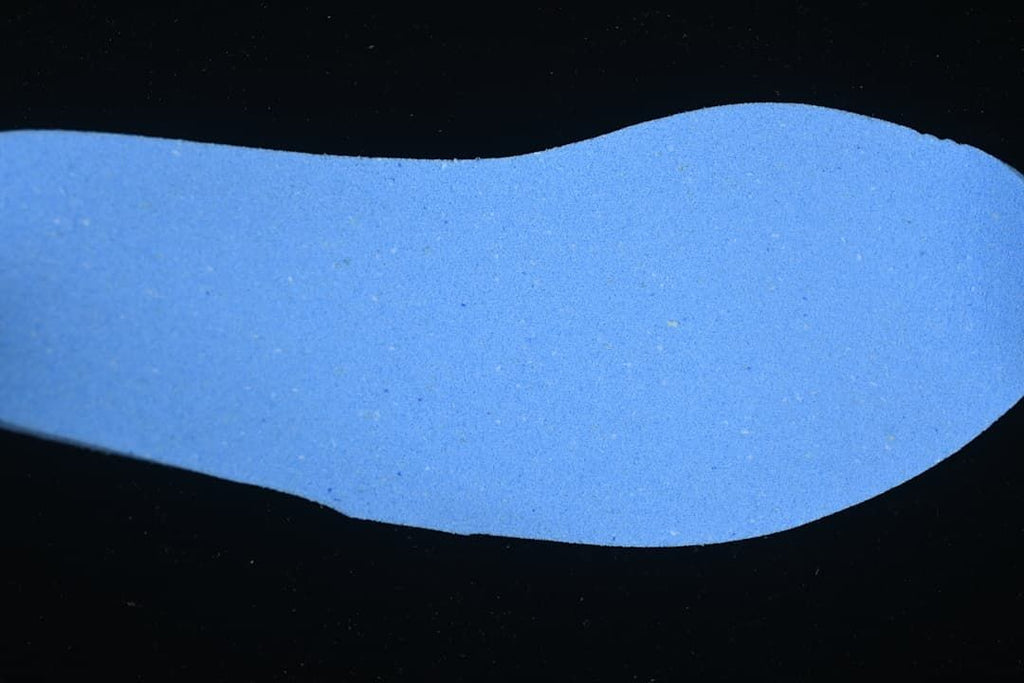 Blue foot-shaped insert displayed against a black background.