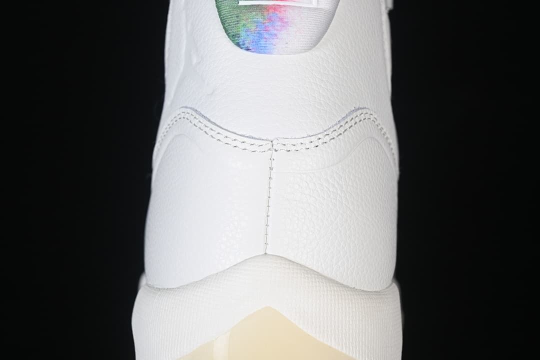 Rear view highlighting the white heel and colorful collar.
