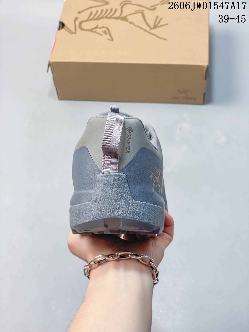 Rear view of the shoe showing the heel pull tab and paneling