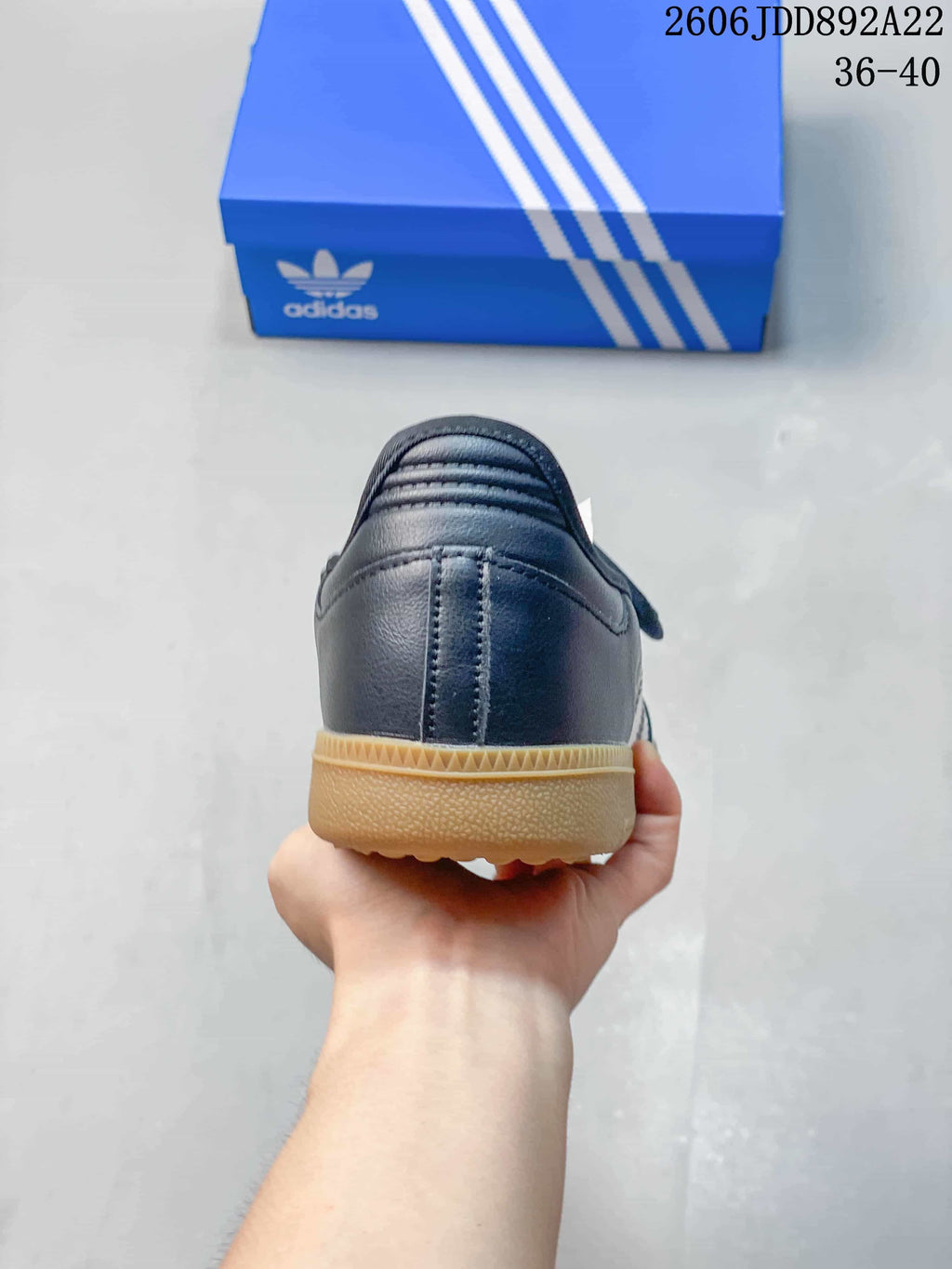 Rear view of a black adidas Samba Jane sneaker with a gum-color outsole.