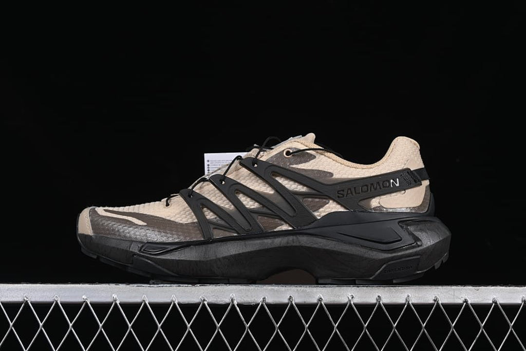 Side profile of beige and black Salomon XT Pu.re Advanced trail running shoe