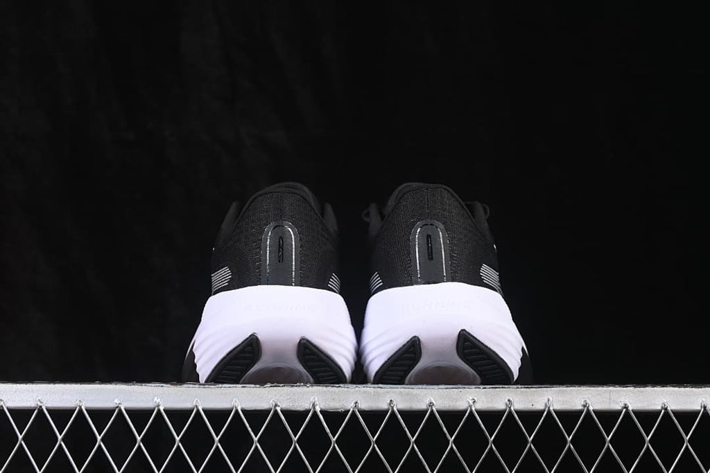 Rear view of both shoes showing the heel details and white midsoles
